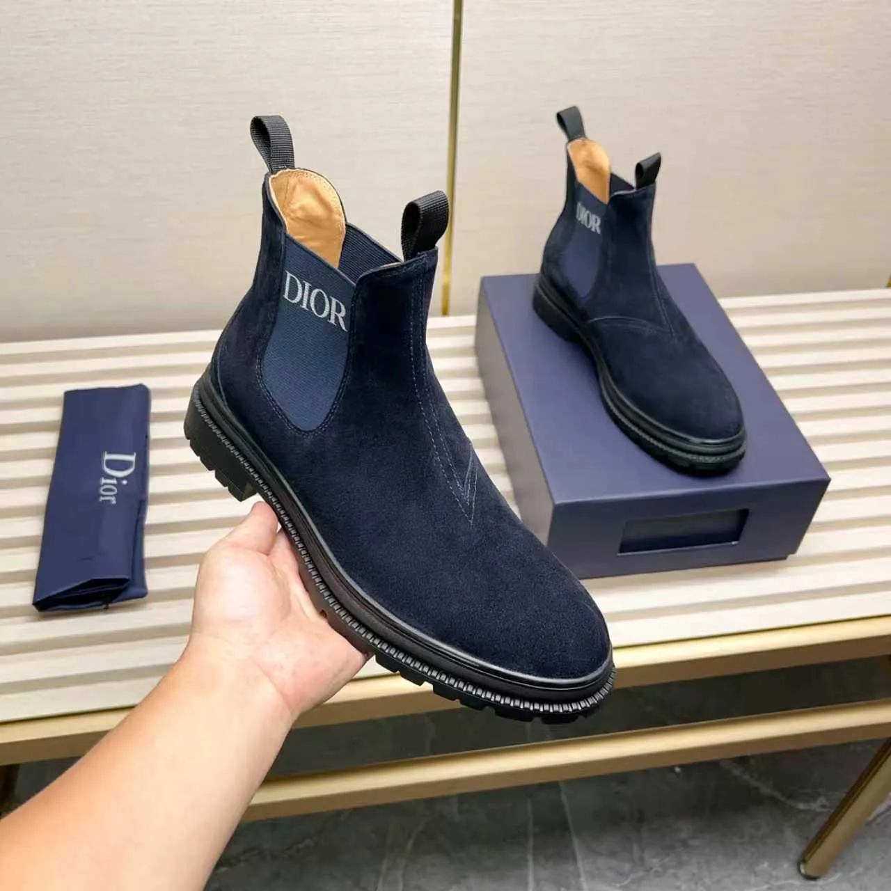 Men's Shoes 💰480 Dior A practical choice that combines protection with classic style. Made from durable Rugged Calf leather, it's tumbled and hand-finished to create a soft suede feel with a rich texture. Elastic side panels and subtle cutouts are inspired by the classic Chelsea boot. Leather upper and lining with Kummel tabs at front and rear, rubber outsole